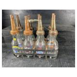 SET OF OIL BOTTLES IN RACK