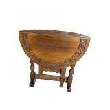 WALNUT KITTINGER CARVED ROUND GATELEG TABLE