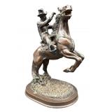 CARVED COMPOSITE COWBOY ON HORSE SCULPTURE