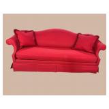 RED HUMPBACK SOFA WITH PILLOWS
