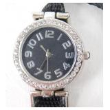 Black Wristwatch Surrounded with Gems