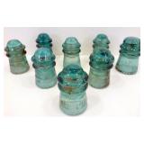 * 8 Green Glass Insulators