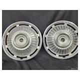 2 Chevrolet wheel cove hub caps.   Look at the