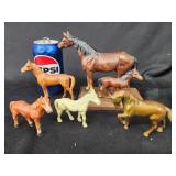 Cast iron horses.   Mare and colt mounted on