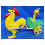 Cowboy duck holding pistol in cart pulled by