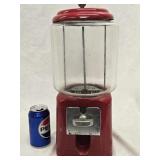 Coin-Op Candy Dispenser has round cylinder glass