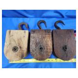 3 wooden wheel block and tackle.   Look at the