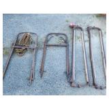 2 hay Spears / Lifts and 2 cow stanchions.