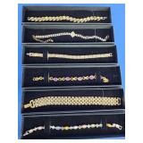 6 costume jewelry bracelets.   No precious metal.