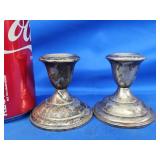 2.5" Pair of sterling candlesticks.   Weighted