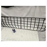 Wrought Iron wall mount flower trough has a grass