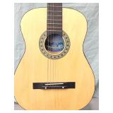 Acoustic guitar 6 string by " Guitara University.