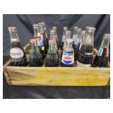 Vintage yellow Coca-Cola crate with 16 Pepsi-Cola