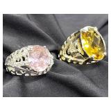 2 Sterling silver rings with colored stones.