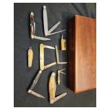 8 pocket knives, brass Chinese pad lock and wood