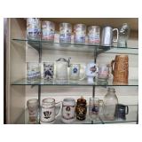 21 assorted cups, glass and advertising steins.
