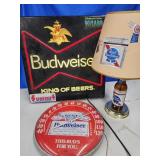 Budweiser lighted bar signs  has stickers on it,