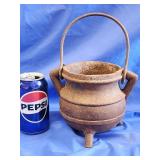 Cast iron vintage footed small cauldron.   Look