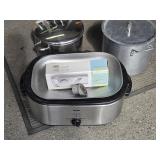 2 Stock pots and electric roaster look at