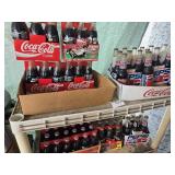 3 Cases of soda- 2 Coca-Cola 1 Pepsi-Cola,