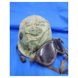 Military helmet and goggles.   Look at the photos