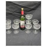 Empty Elvis Wine bottle and 7 clear champagne