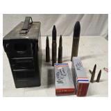 Ammo box and bullets.   Large shells are empty