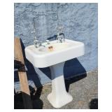 Vintage porcelain enamel pedestal sink with goose