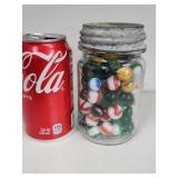 Pint jar with marble and glass beads.   Look at