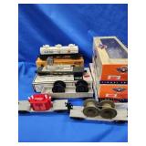 5 Lionel Train cars, flat car w/ transformer,