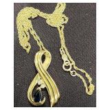 14 K gold chain with ribbon style pendant stamped