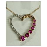10 K heart shaped pendant with rubies and Diamond
