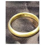 14 K gold band ring.  Yellow domed gold band is