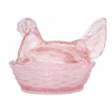Pink hen on nest