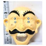 Cast iron 4 eyes man bottle opener