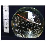 Round art glass paperweight w/ bird inside