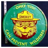 Green round metal Only You Smokey Bear sign