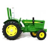 Die cast John Deere tractor with roll bar