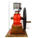 Vintage coffee grinder on wood base