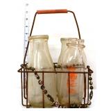 Lot of 4 vintage milk bottles in wire carrier