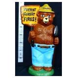 Cast iron 7in Smokey Bear figural bank w/ shovel