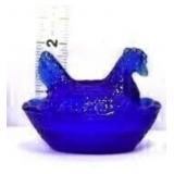 Miniature cobalt hen on nest