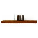 Vintage iron flax comb on board