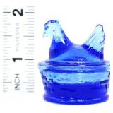 Miniature blue glass hen on nest