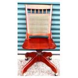 Vintage cane back rolling office chair