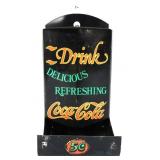 Black metal Coca Cola match holder