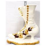 Vintage white 10in pottery boot w/ yellow flowers