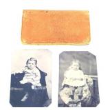 Pair of tin type baby photos in leather case