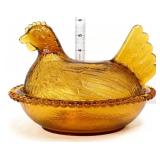 Vintage amber hen on nest