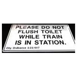 Metal Do Not Flush While Train In Station sign
